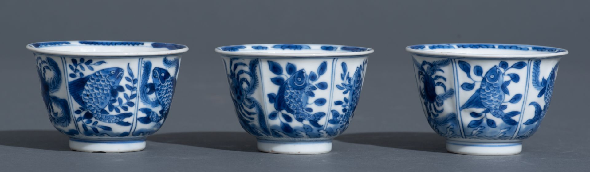 Three Chinese blue and white Kangxi period teacups and saucers, decorated with an underwater jungle; - Bild 8 aus 24