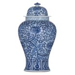 A Chinese blue and white floral decorated vase and cover, H 43,5 cm