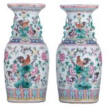 A pair of Chinese famille rose vases, decorated with cockerels under a peach tree, paired with Fu li