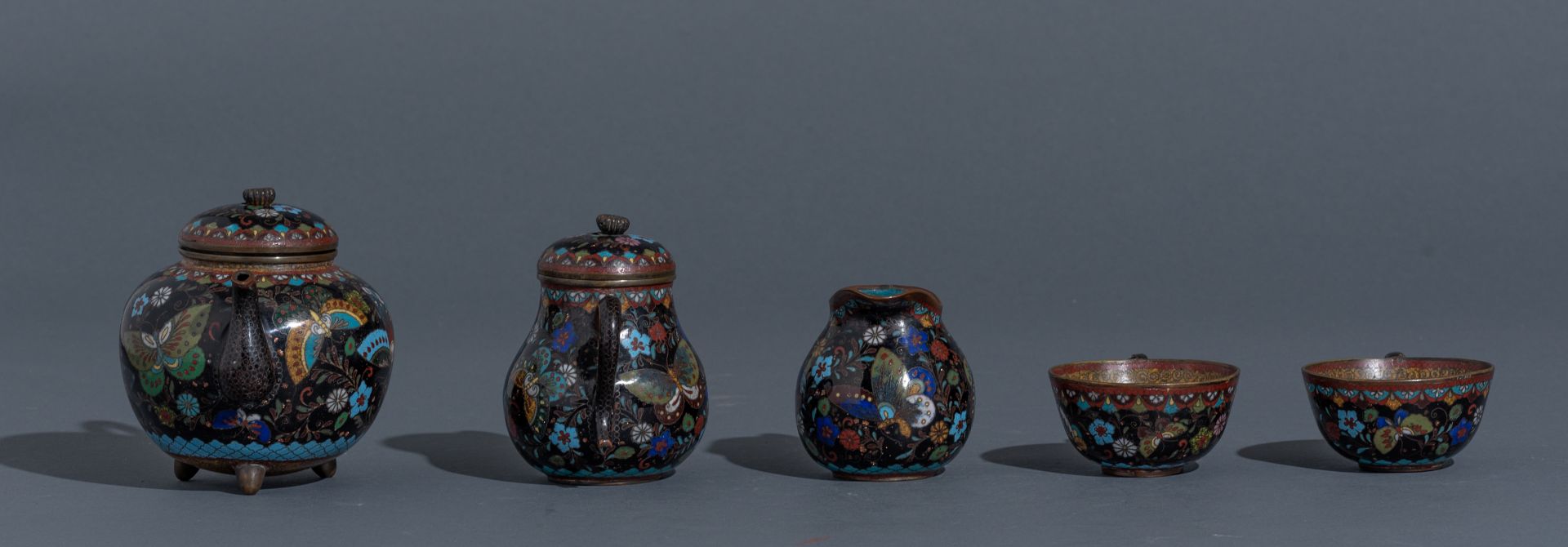 A Japanese cloisonné enamel tea set, i.e. a tray, two cups and saucers, a teapot and cover, a milk j - Image 7 of 9