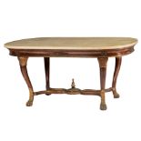A gilt and mahogany veneered French Restauration style centre table, on claw-and-ball feet, with gil