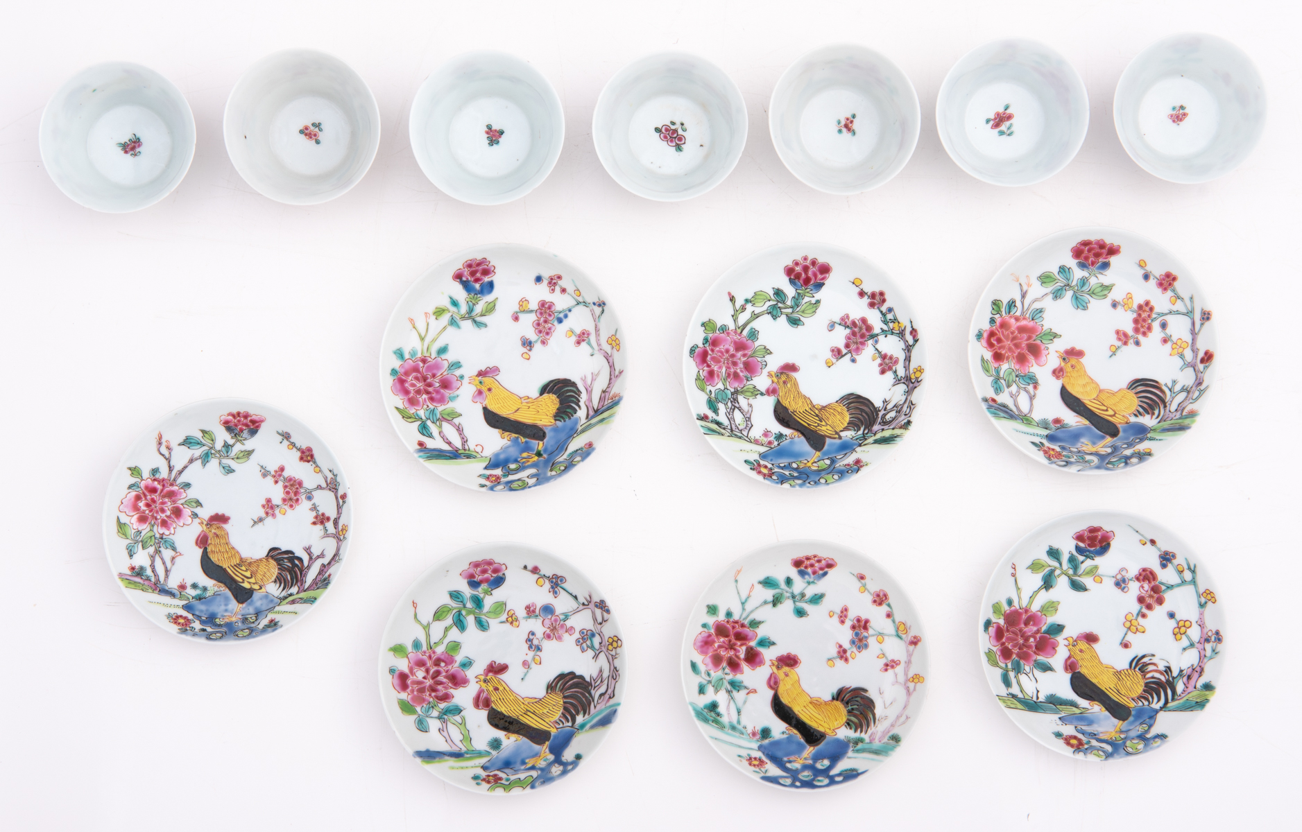Seven famille rose cups and matching saucers, decorated with a cockerel amidst flower branches, Yong - Image 3 of 8