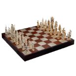A large and exceptional Chinese rosewood and mother-of-pearl inlaid chess set, with richly carved iv