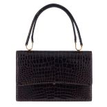 A Delvaux top handle handbag in black croco leather, with a matching wallet and mirror inside, H 17