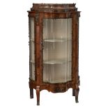 A fine mahogany veneered Rococo style display cabinet, decorated with bronze mounts and the inside w