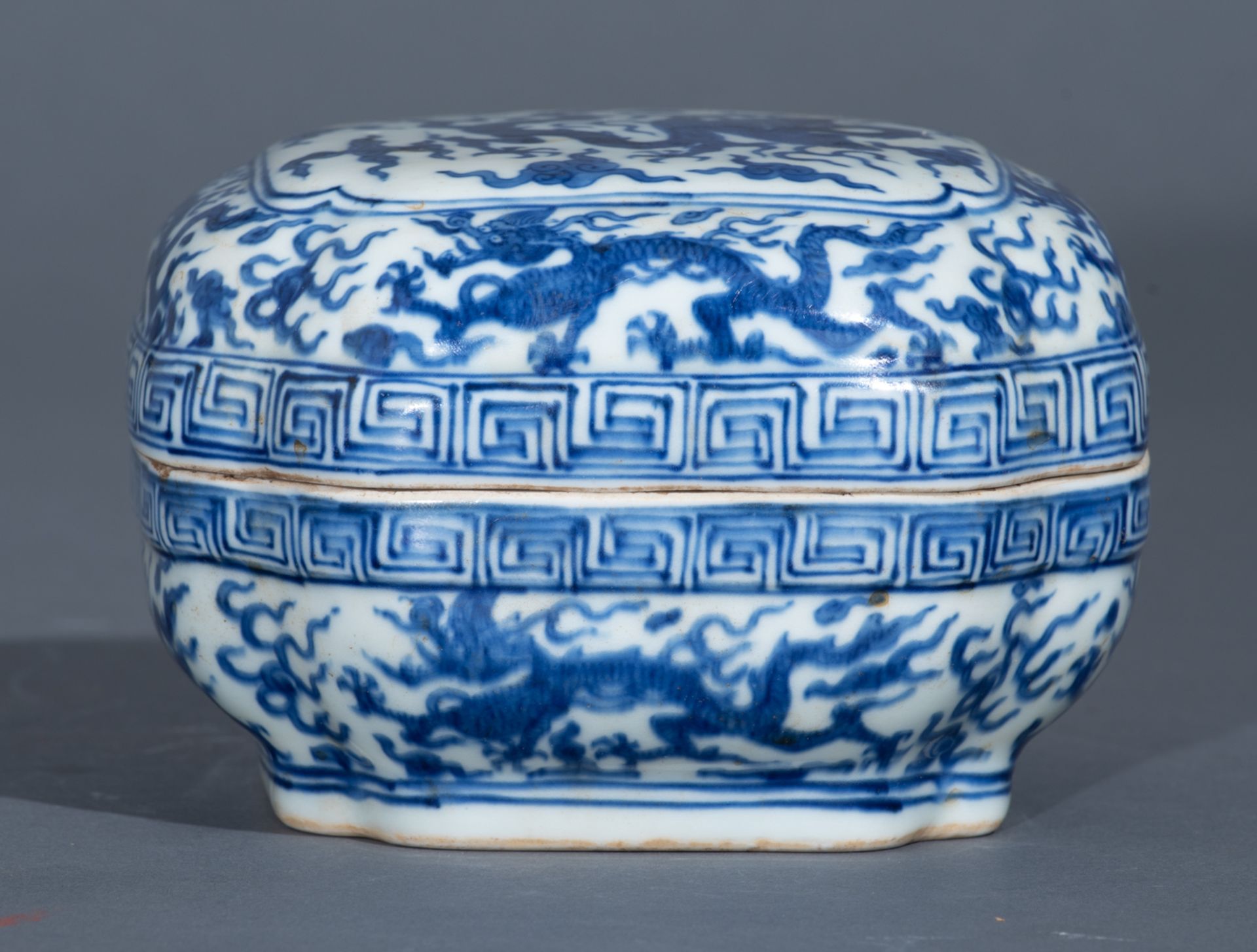 A Chinese Ming style blue and white rectangular box and cover, the top panel decorated with a dragon - Image 4 of 10