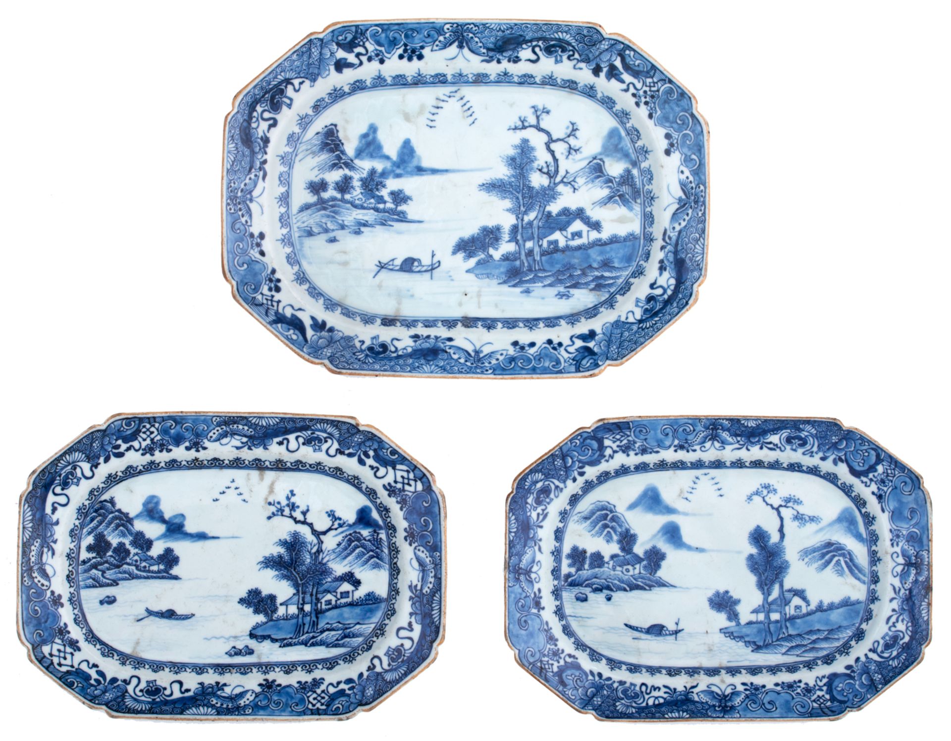 Three Chinese blue and white Nanking porcelain plates, decorated with a river landscape, 18thC, W 21