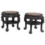 Two Chinese exotic hardwood stands, richly carved with floral decoration, dragon heads and standing