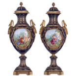 A large pair of covered bleu royale ground Sèvres vases with fine gilt bronze mounts, the roundels p