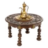 A Renaissance-inspired walnut tea table, the tabletop decorated with carved profile portraits in ton
