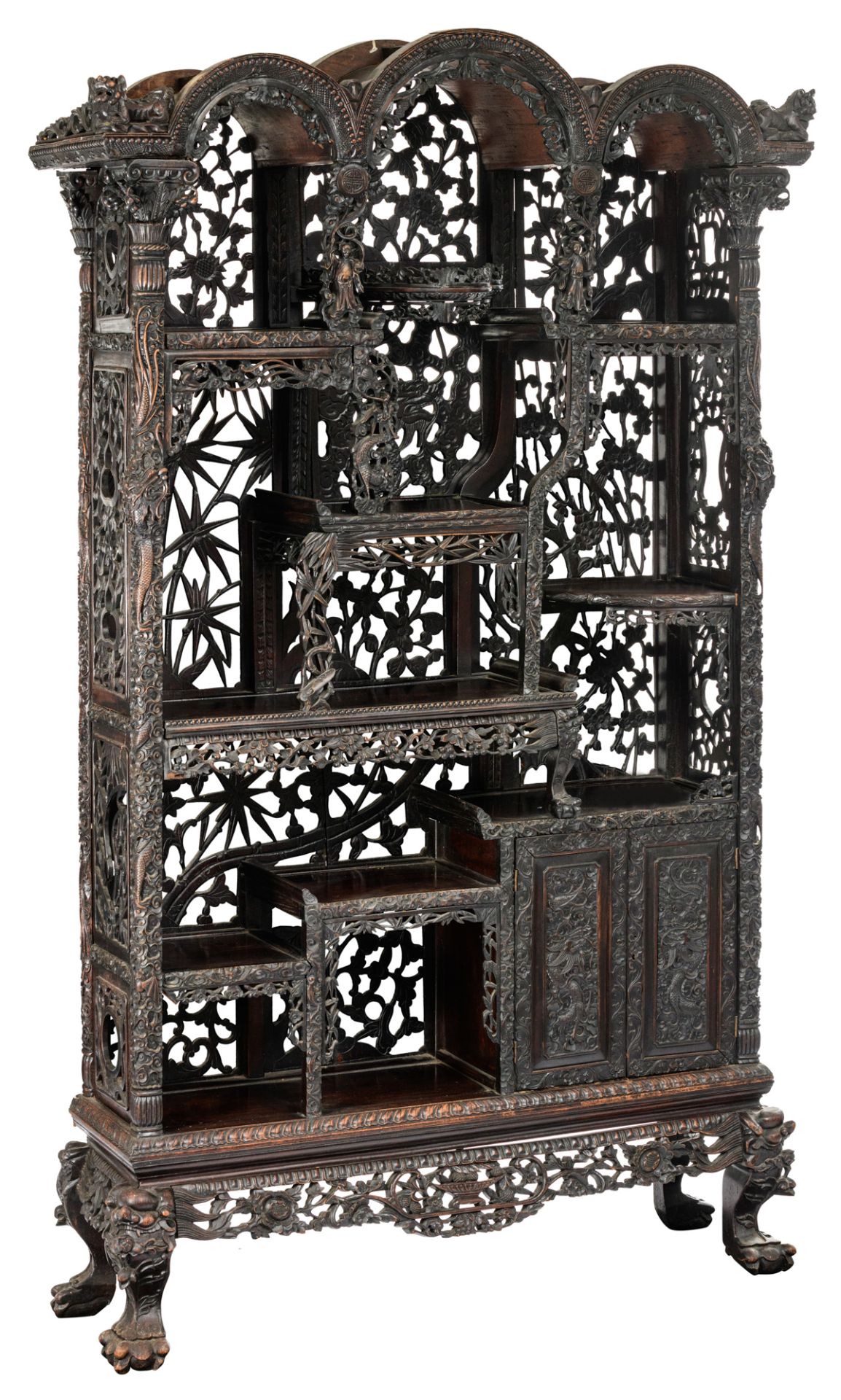 A Chinese exotic hardwood display cabinet, finely sculpted with floral decorations, dragons and Fu l