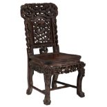 A Chinese abundantly carved exotic hardwood chair