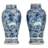 A pair of blue and white floral decorated vases