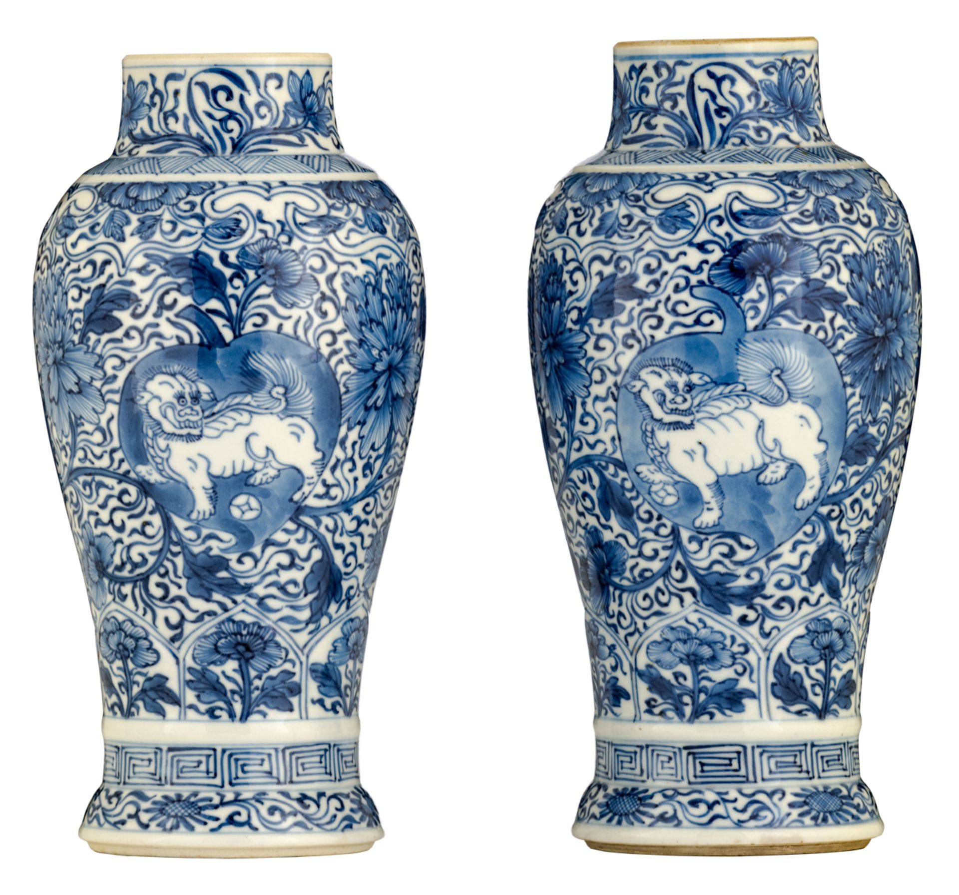 A pair of blue and white floral decorated vases