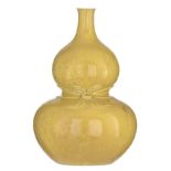 A Chinese yellow monochrome glazed double gourd vase