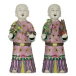 Two Chinese porcelain figures of a smiling boy