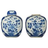 Two blue and white floral decorated ginger jars and covers