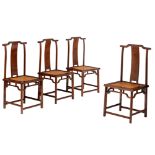 A fine set of four Chinese rosewood yoke-back chairs