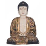 A large Japanese Satsuma figure of a seated Buddha