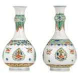 A pair of famille verte bottle vases