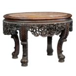 A Chinese richly carved exotic hardwood table with marble top