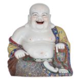 A large Chinese famille rose seated smiling Budai