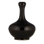 A Chinese monochrome deep brown-glazed garlic-mouth bottle vase