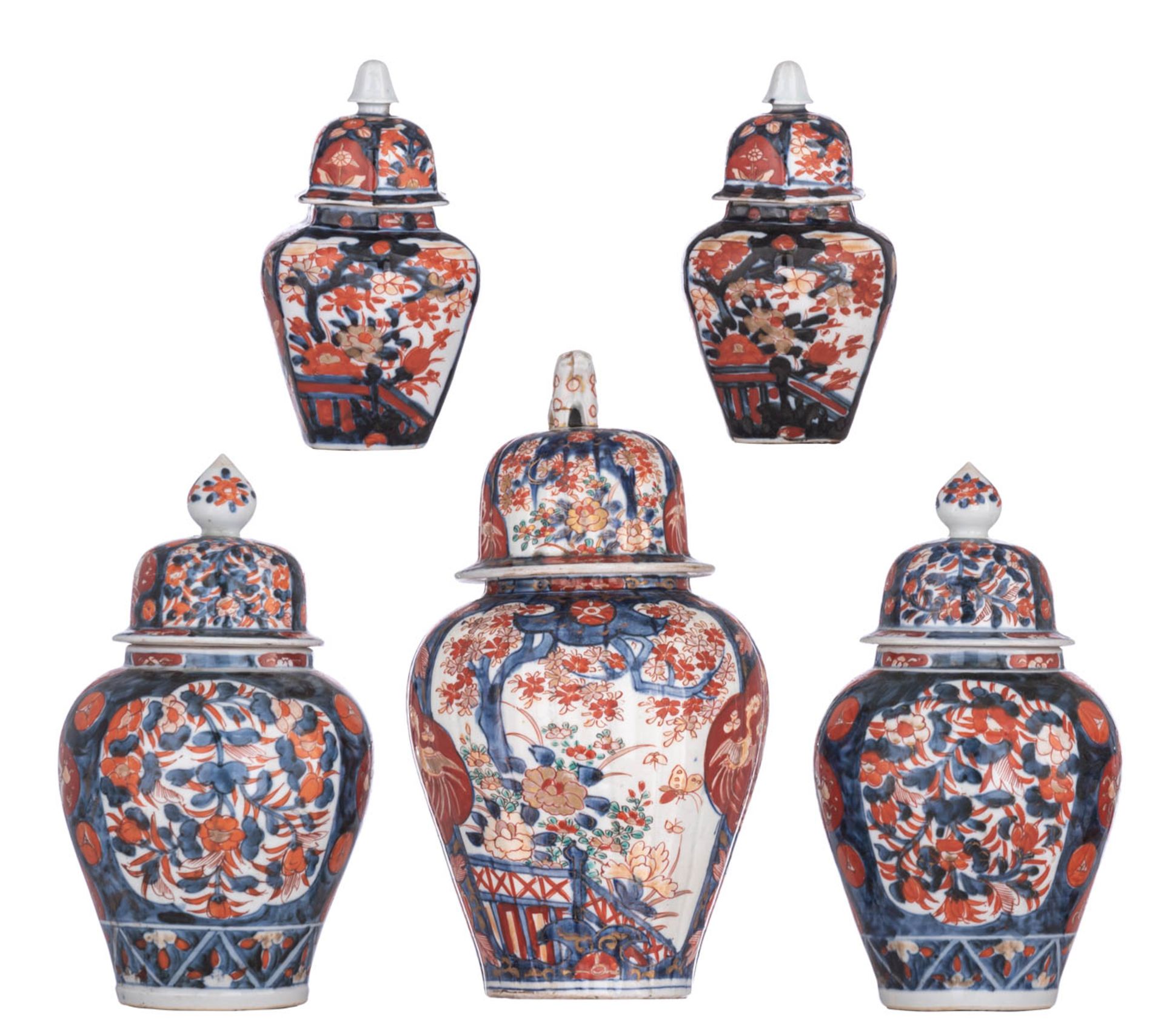 A collection of five Japanese Imari vases and covers