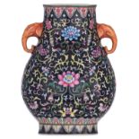 A Chinese famille noire floral decorated hu vase