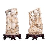 Two Chinese ivory Luohan figures decorated with black-stained engraving