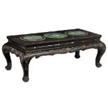 A Chinese black lacquered coffee table with floral decoration