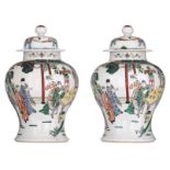 Two Chinese polychrome vases and covers