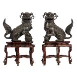 A pair of Japanese bronze playful Shishi dogs