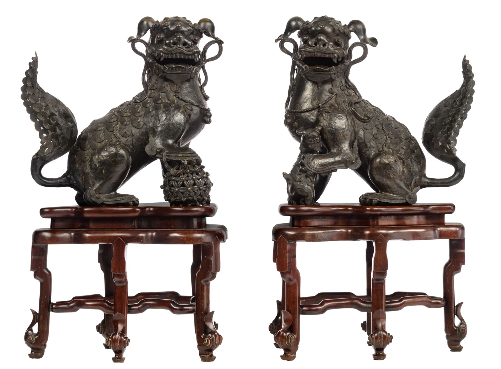 A pair of Japanese bronze playful Shishi dogs