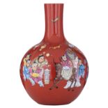 A Chinese famille rose on coral-red ground bottle vase