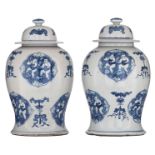 A pair of Chinese blue and white covered vases