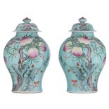 A pair of turquoise ground covered vases