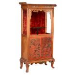A Chinese inspired mahogany display cabinet
