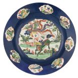 A Chinese famille verte and bleu poudré plate