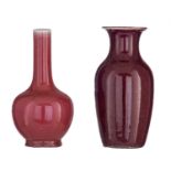 A Chinese peach-bloom bottle vase; added a sang-de-boeuf baluster-shaped vase