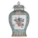 A Chinese famille verte floral decorated vase and cover