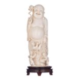 A Chinese Canton ivory statue depicting Budai accompanied by children