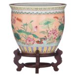 A Chinese orange ground famille rose floral decorated fish bowl