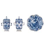 Two Chinese Kangxi period blue and white chalices with covers