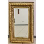 Spiegel mit Prunkrahmung, facettiertes Glas, 20. Jh., wohl Frankreich. Maße: 69 x 33 cm.