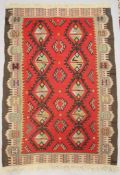Kelim, wohl Kaukasus, Anfang 20. Jh., Flachgewebe, rotgrundig mit geometrischem Muster, Maße: ca.