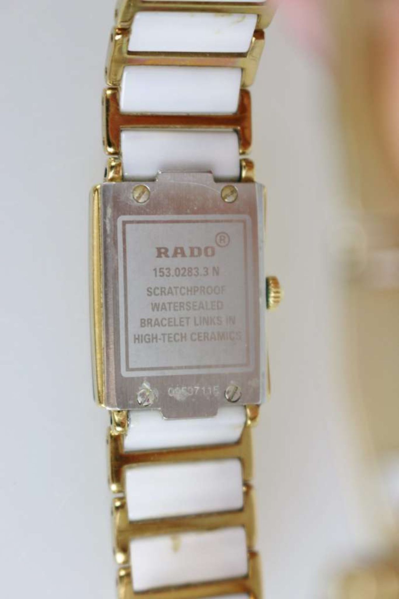 RADO Damenarmbanduhr DiaStar, Edelstahl vergoldet, weißes Keramik-Gliederband, Perlmutt-Ziffernblatt - Bild 5 aus 5