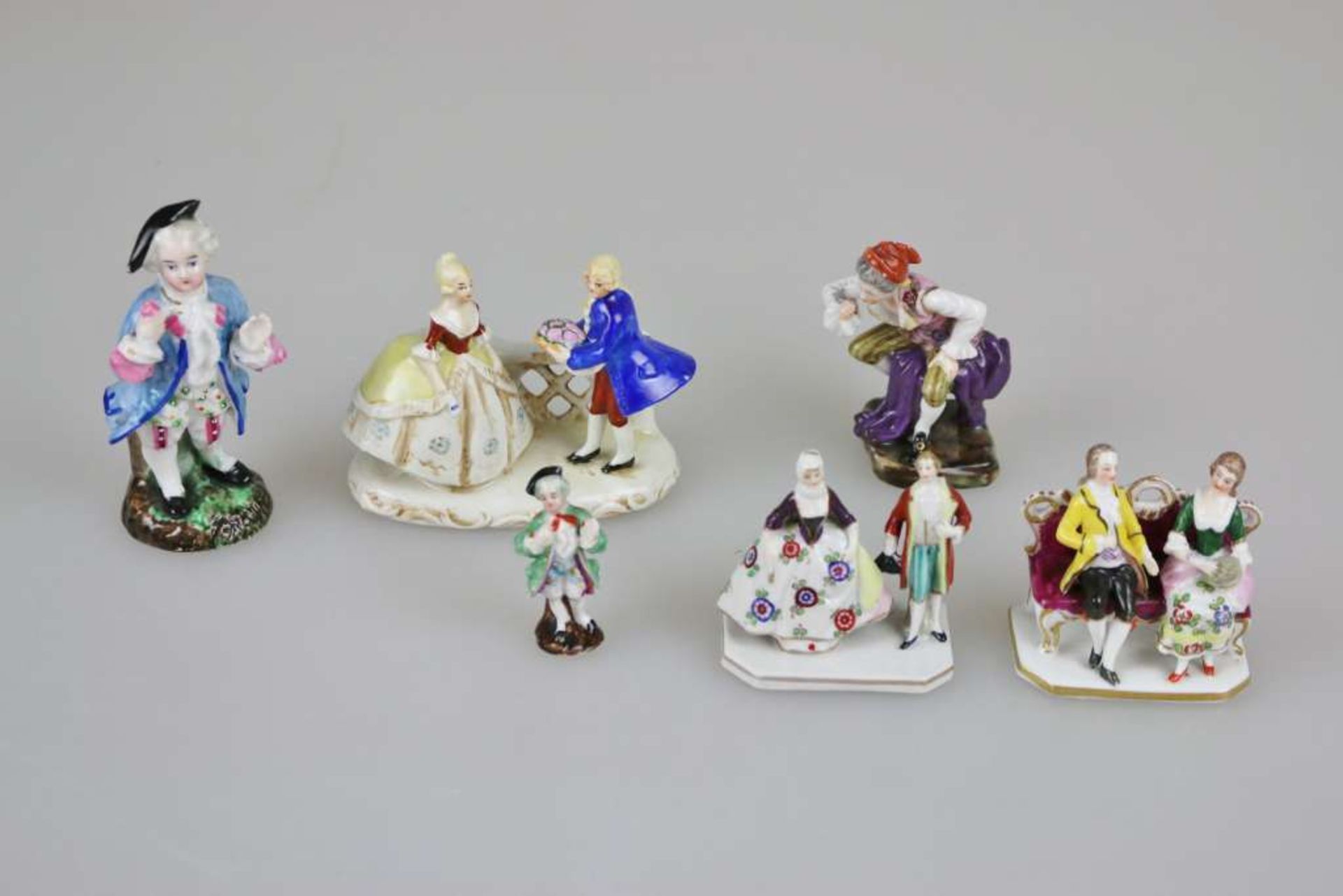 Konvolut 6 Porzellanfiguren, überwiegend Augarten Wien, 2 ungemarkt, 20. Jh., polychrom gefasst,