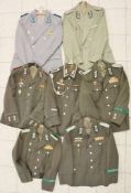 DDR, Uniform Konvolut, 7 verschiedene Uniformjacken, teilweise mit Bandschnallen und Auszeichnu