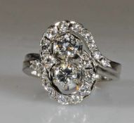 Ring, WG 585, 2 Brillanten zus. ca. 0.70 ct., etwa w/vvs, 18 Brillanten zus. ca. 0.60 ct., etwa fw-